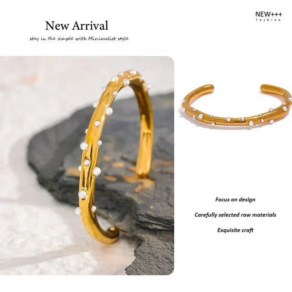 Gold bracelet with white stones on a textured surface, labeled 'New Arrival' by NEW++ Fashion.