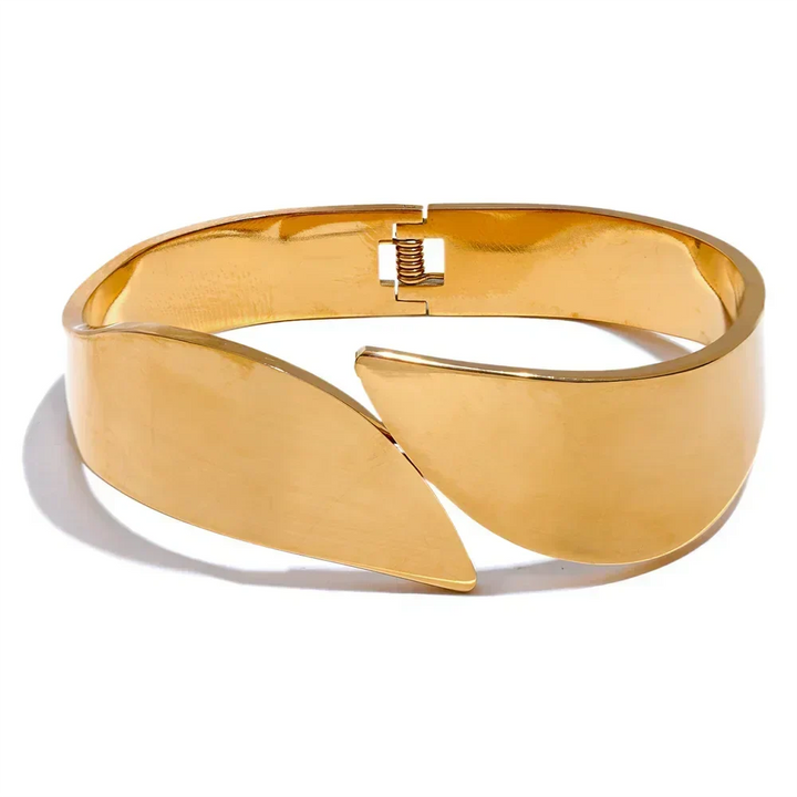 Gold leaf-shaped bracelet on a white background