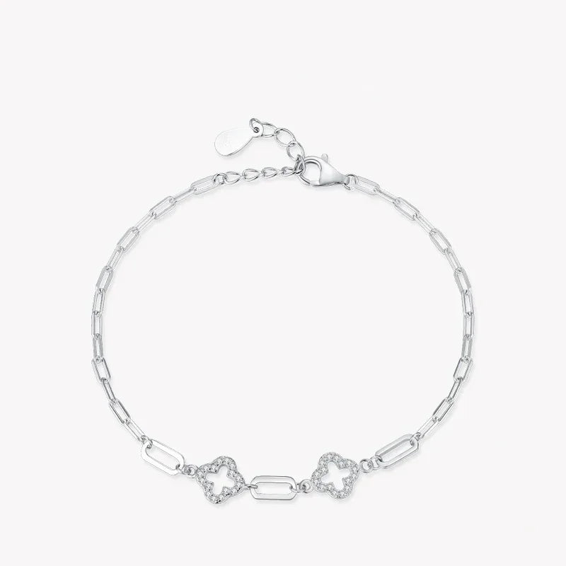 925 silver chain bracelet with geometric links and two floral motifs on white background