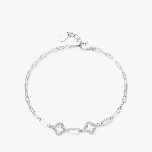 925 silver chain bracelet with geometric links and two floral motifs on white background