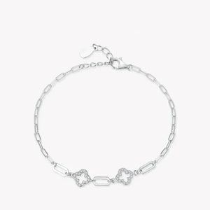Silver bracelet with star-shaped links on a white background