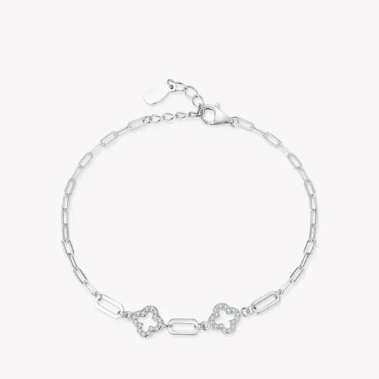 Silver bracelet with star-shaped links on a white background