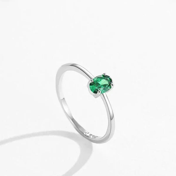 Pure Emerald CZ Ring - TM & Co. Jewels- Silver ring with a green gemstone on a white background.