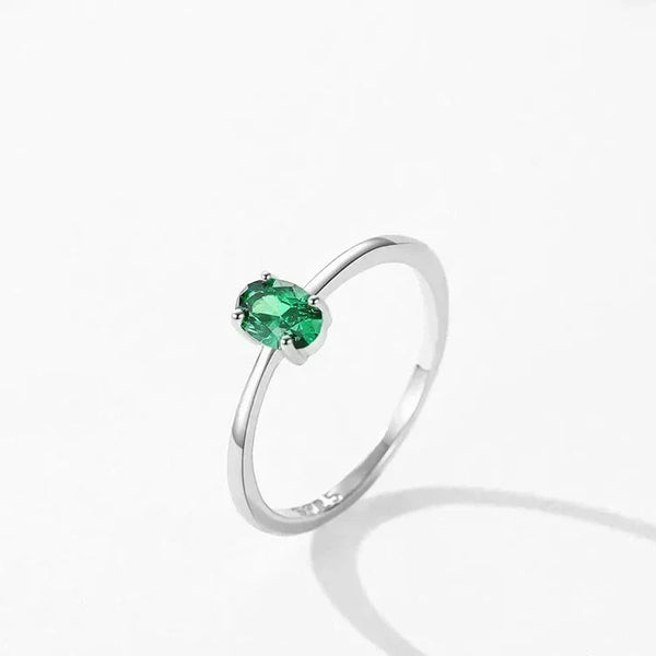 Pure Emerald CZ Ring - TM & Co. Jewels- Silver ring with a green gemstone on a white background.