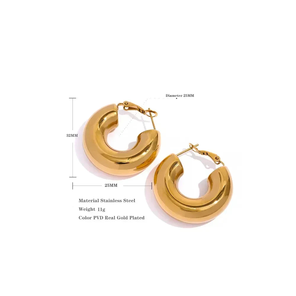 Chunky gold-plated stainless steel hoop earrings, 32mm x 25mm, on white background