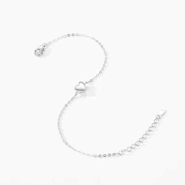 Silver Mia Heart Bracelet - TM & CO. JEWELS with a heart charm on a white background.