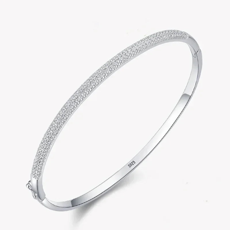Sterling silver 925 bangle bracelet with pavé cubic zirconia on white background