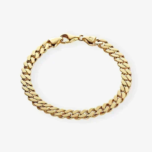 Gold chain bracelet on a white background.