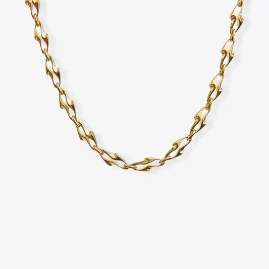 Gold chain necklace on a white background