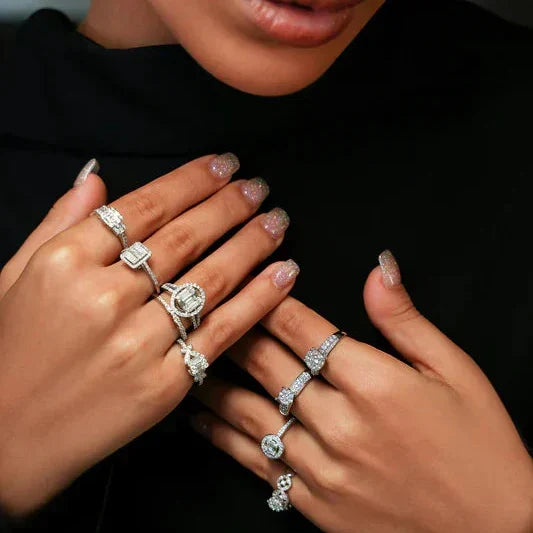 Woman's hands wearing vibrant gemstone rings from the TM & Co. collection.