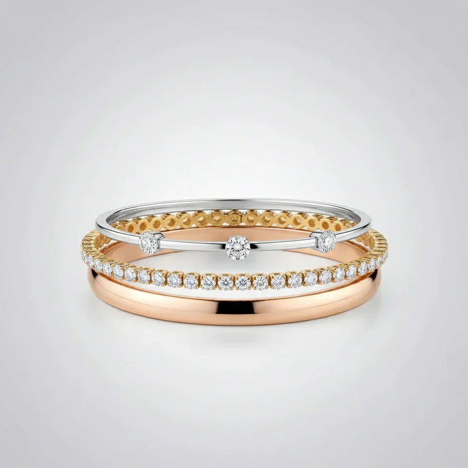 A sophisticated layered bracelet stack from the TM & Co. Jewels collection, featuring a combination of gold and diamond-accented designs.