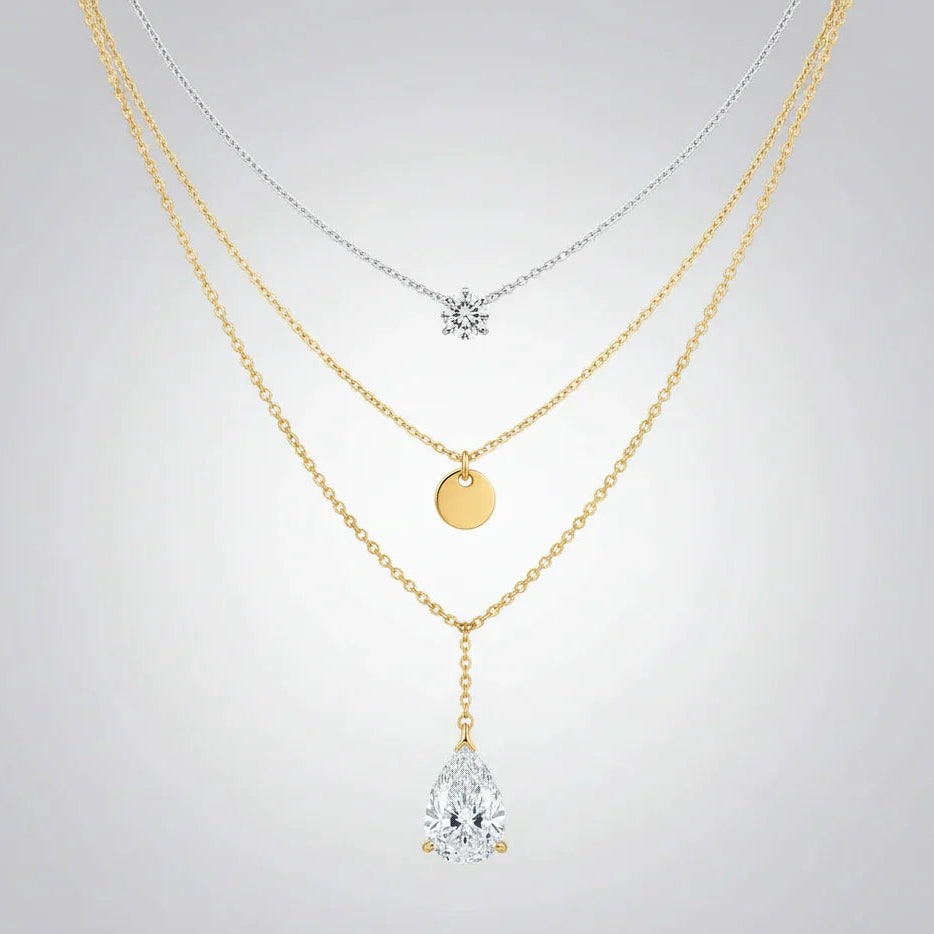 A quality-crafted layered pendant necklace set from the TM & Co. Jewels collection, featuring delicate chains and brilliant stone accents.